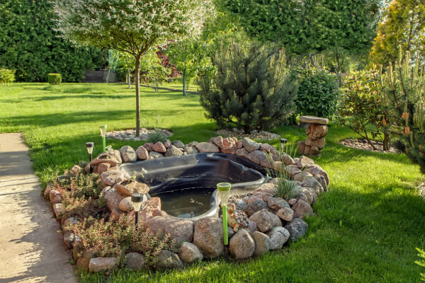 Backyard Landscaping Ideas backyard landscaping with patio seating, lawn area, and garden beds